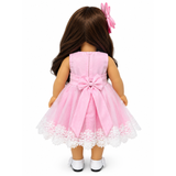 The back of an 18-inch doll wearing pink party dress with layered tulle skirt, white lace trim, attached bow on the back of the dress, and matching pink hair bow