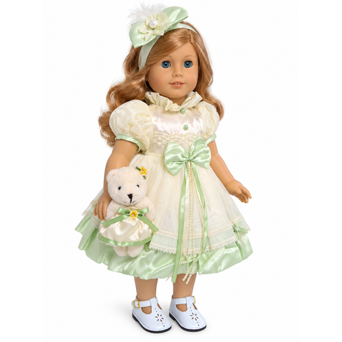 18-inch doll wearing a yellow and green silk dress with tulle, satin bow, pearl detailing, floral headband, and matching teddy bear.