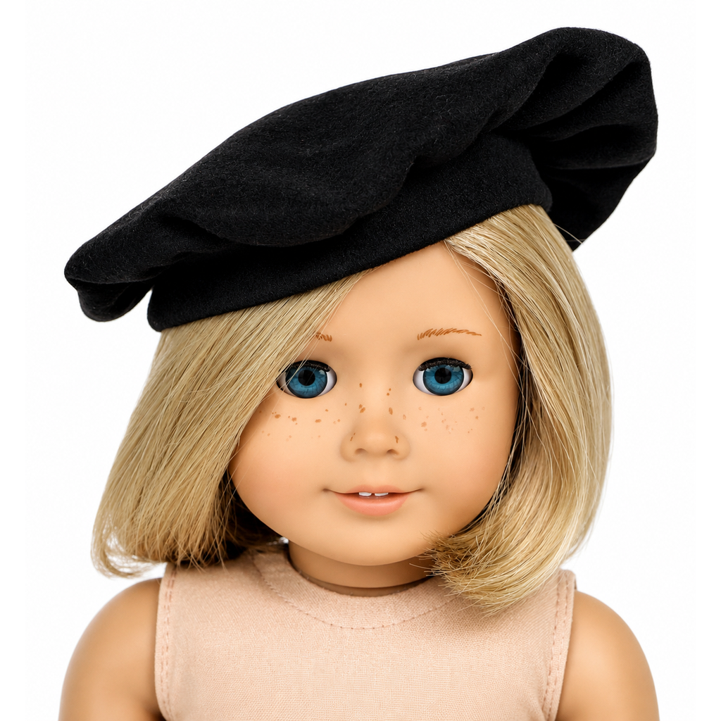 Classic black beret hat for 18-inch dolls displayed on a blonde American Girl®-size doll. Soft French-inspired doll accessory perfect for Paris-themed outfits, costumes, and everyday doll fashion.