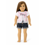 An 18-inch Doll wearing a 'Paris' themed t-shirt and cuffed denim shorts