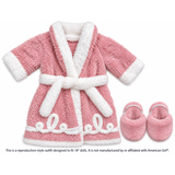 An 18-inch doll's pink plush robe with white trim and a matching white belt, shown with pink plush slippers, with the note of: This is a reproduction-style outfit designed to fit 18" dolls. It is not manufactured by or affiliated with American Girl