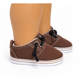 Brown canvas no-tie shoes for 18-inch dolls with black laces, silver-tone eyelets, white stitching, and white striped soles.