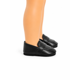 Black faux-leather loafers for 18-inch dolls, shown on a doll's legs against a white background.