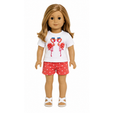 18-inch doll wearing a white T-shirt with embroidered coral flamingos, coral polka dot shorts, and white sandals.