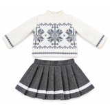 A two-piece 18-inch doll's outfit set featuring a cream knit sweater with a gray Nordic snowflake pattern and a matching gray pleated skirt with white trim, displayed on a clean white background.