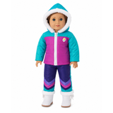 An 18-inch doll wears a colorful winter outfit: a teal-and-magenta zip-up jacket with a white-trimmed hood, matching purple-and-pink chevron pants, and white boots with white faux-fur trim, set against a plain white background.