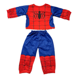 An 18-inch doll's clothes Spider-inspired Pajama set consisting of a long-sleeve top and matching pants. The top is red with blue sleeves and a black spider emblem on the chest, while the pants are blue with red cuffed legs and black web-like patterns.